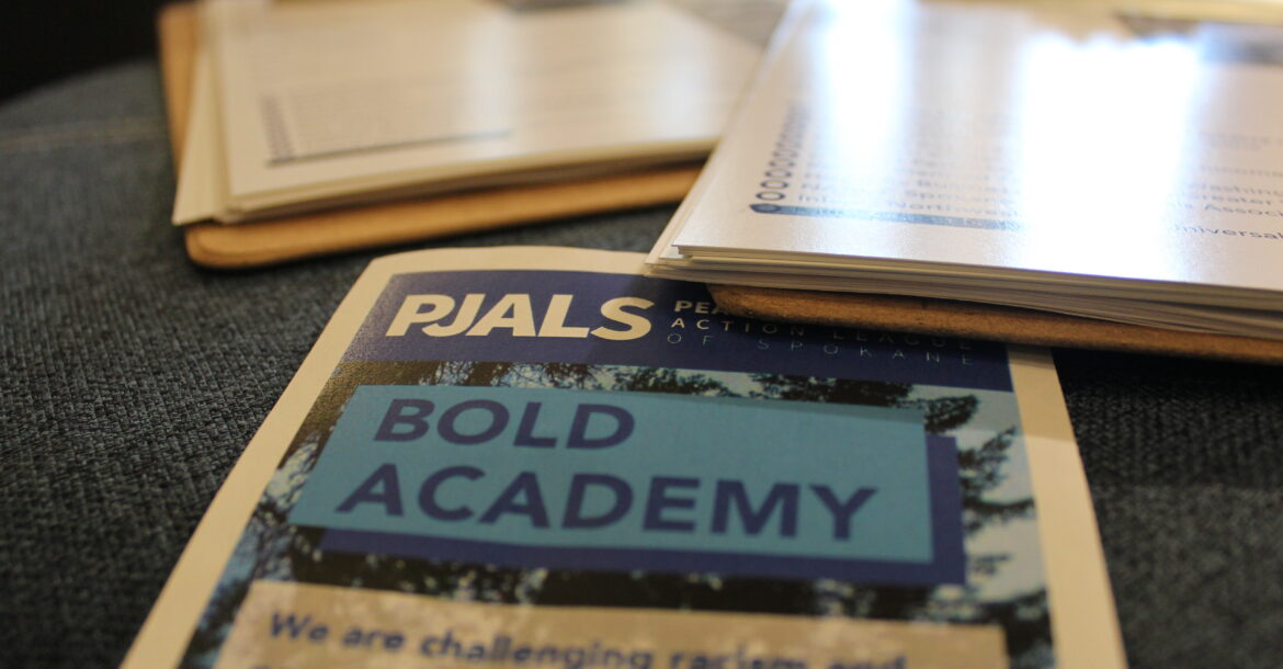 Photo of clipboards and pamphlet that says "PJALS Bold Academy"